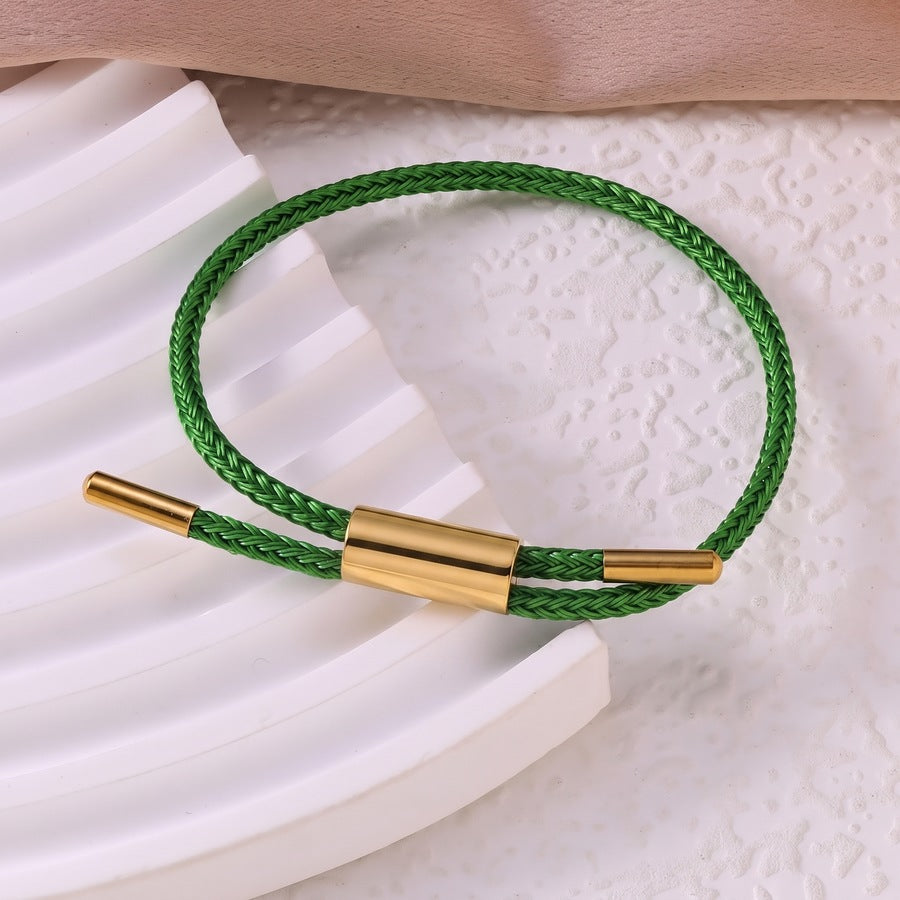 Sableau Woven Steel Bracelet in green, braided steel cord with a gold-plated slide clasp