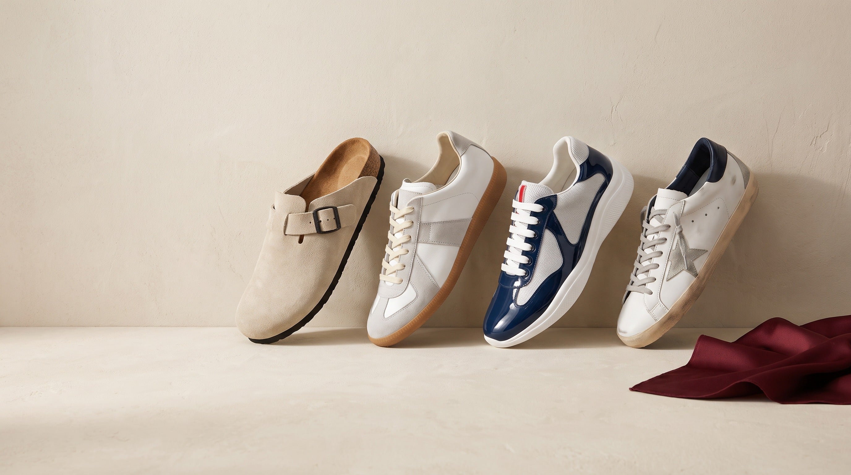 Four Sableau shoes in a row on a bone plaster surface