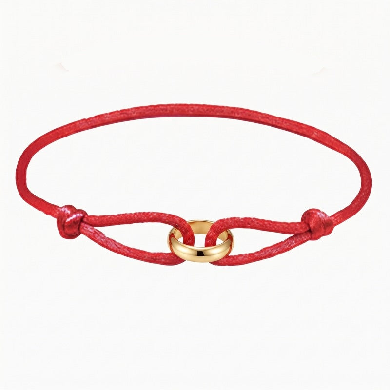 Sableau Trio Cord Bracelet in red, three-tone steel rings on an adjustable cord