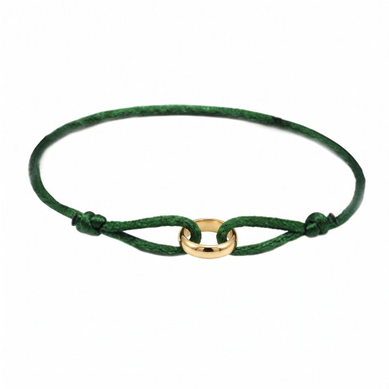 Sableau Trio Cord Bracelet in green, three-tone steel rings on an adjustable cord