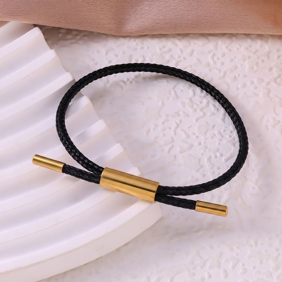 Sableau Woven Steel Bracelet in black, braided steel cord with a gold-plated slide clasp
