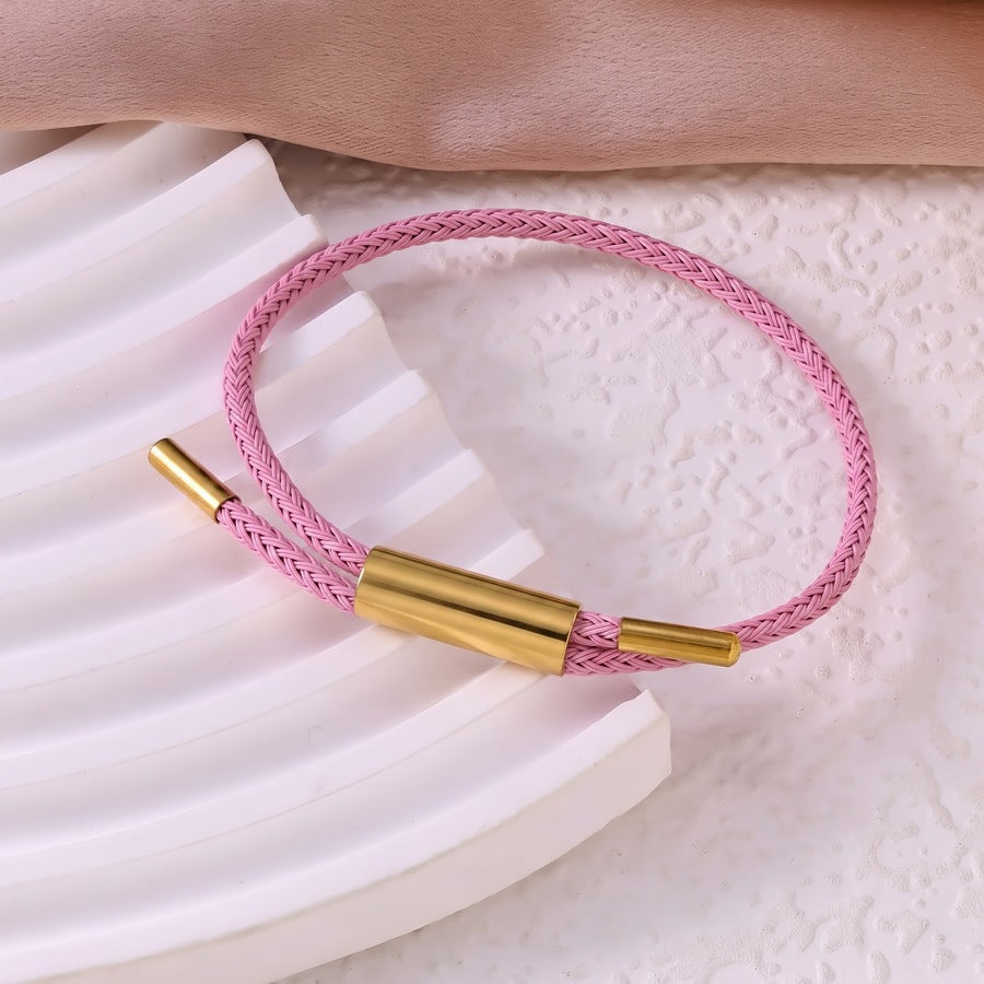 Sableau Woven Steel Bracelet in light pink, braided steel cord with a gold-plated slide clasp