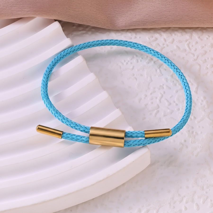 Sableau Woven Steel Bracelet in sky blue, braided steel cord with a gold-plated slide clasp
