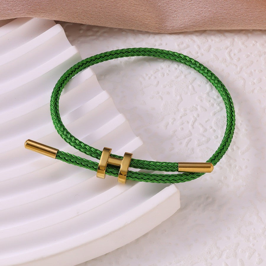 Sableau Woven Steel Bracelet in green, braided steel cord with a gold-plated slide clasp