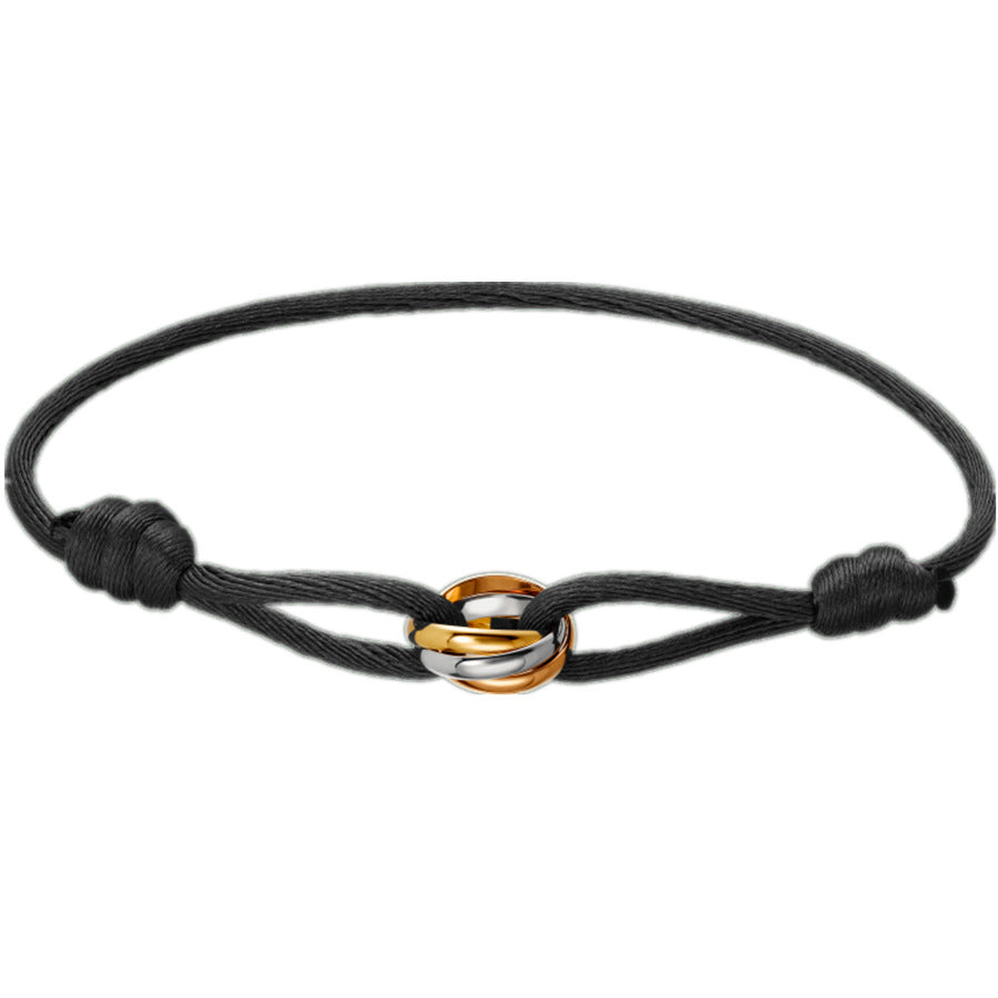 Sableau Trio Cord Bracelet in black, three-tone steel rings on an adjustable cord