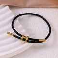 Sableau Woven Steel Bracelet in black, braided steel cord with a gold-plated slide clasp