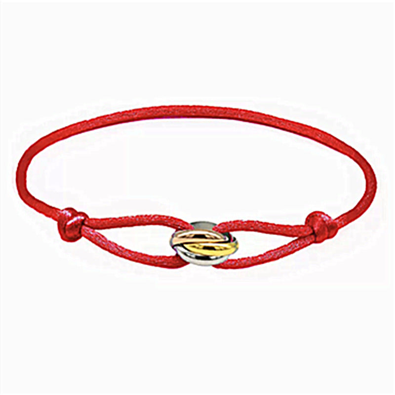 Sableau Trio Cord Bracelet in red, three-tone steel rings on an adjustable cord