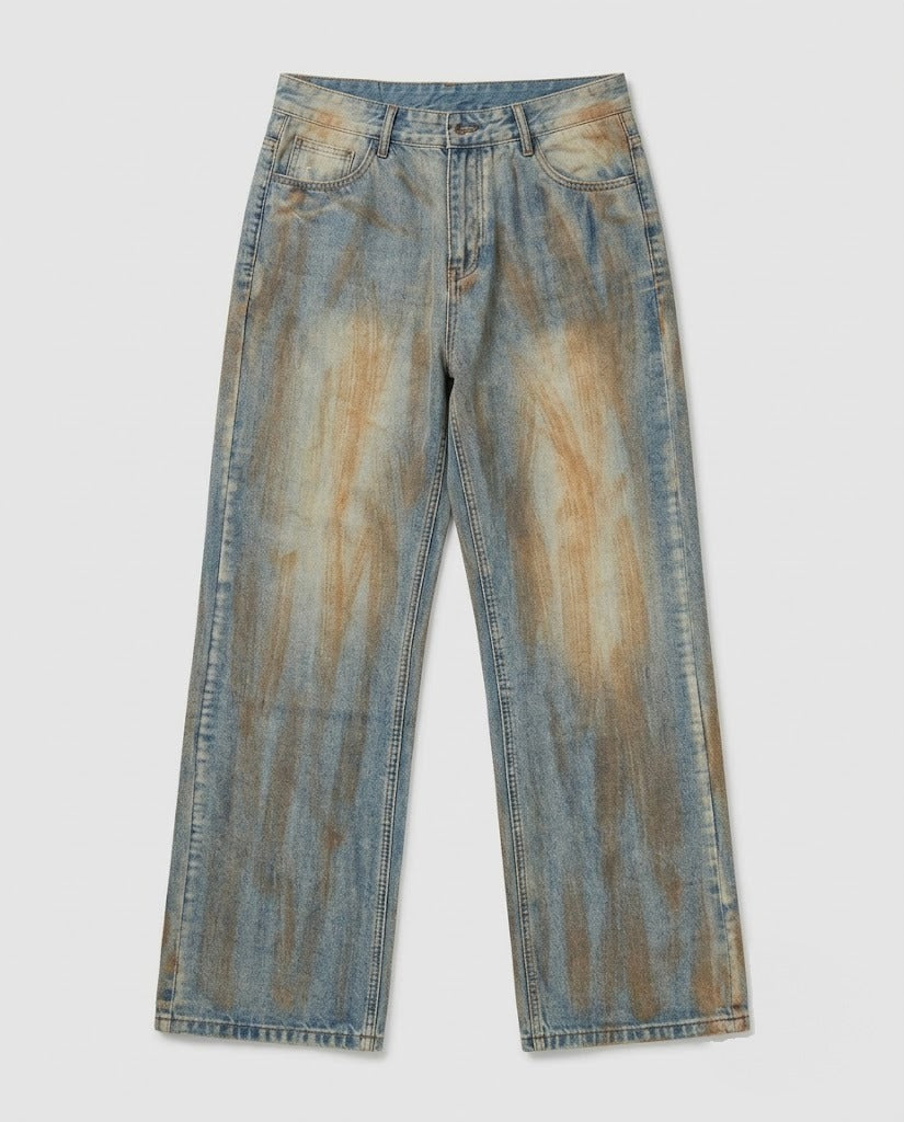 Rust-tinted tie-dye straight-leg jeans — flat lay