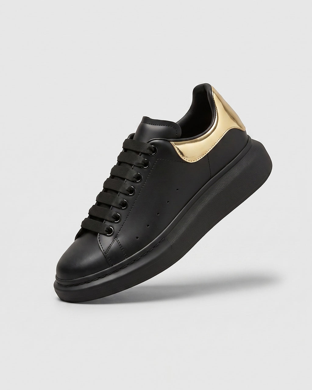 Sableau MQ Sneakers in black with gold heel