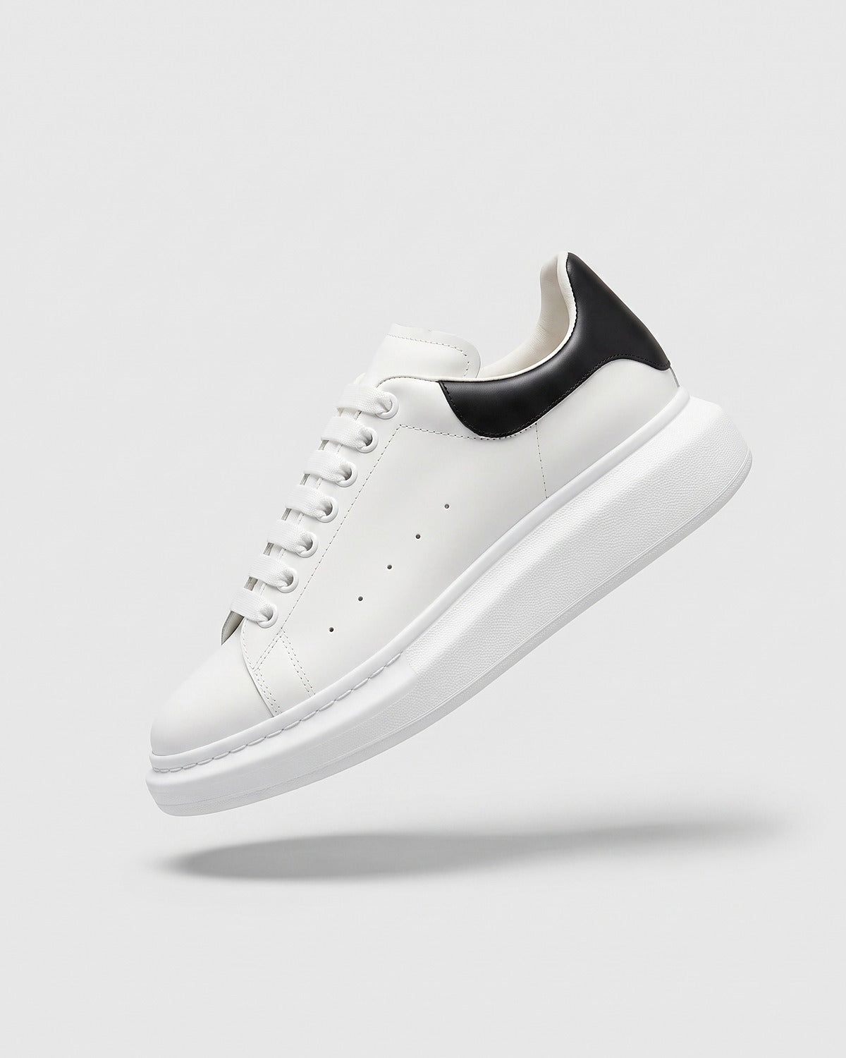 Sableau MQ Sneakers in white with black heel
